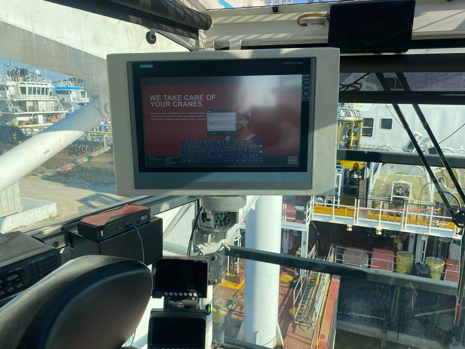 ALATAS operator interface on a Siemens SIMATIC HMI installed inside the crane cab
